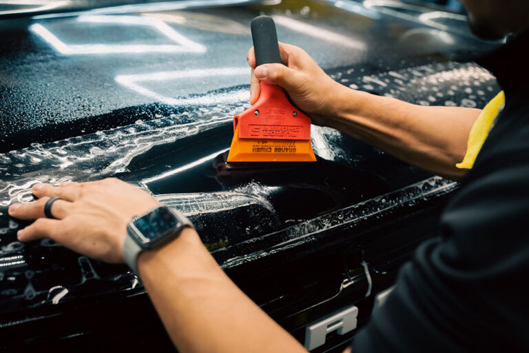 Technician applying protective film